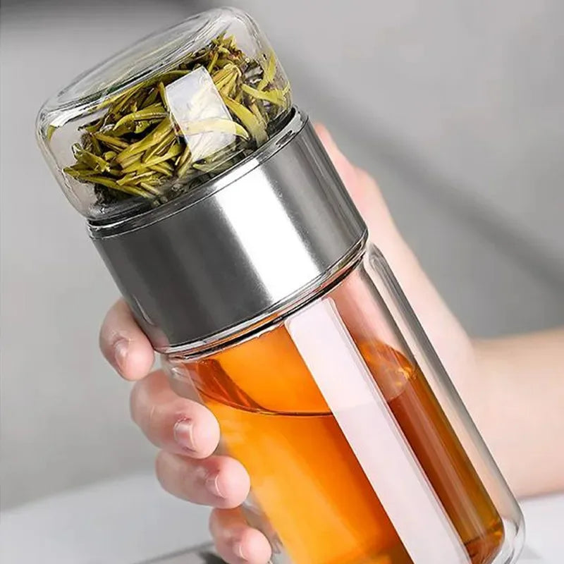 Enjoy your tea anywhere with this 420ML borosilicate glass infuser bottle. Features a sleek double-layer design, leakproof lid, and built-in strainer. Great for loose-leaf tea!
