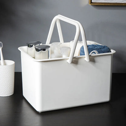 White portable shower caddy basket with built-in drainage holes for dorm or bathroom use.
