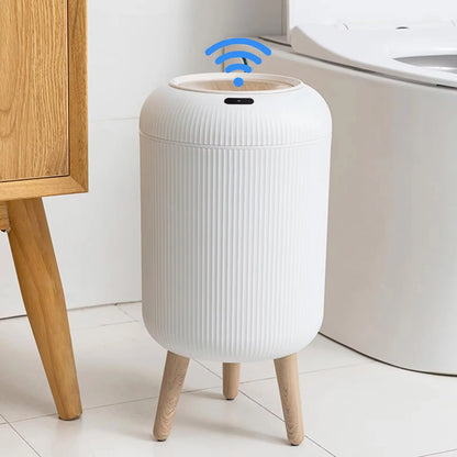 Upgrade your space with this sleek smart trash can featuring a motion sensor lid and modern wooden legs. Perfect for bathrooms, bedrooms, or dorms, it opens automatically for hands-free use—keeping your environment clean and hygienic. Stylish, functional, and easy to use!

