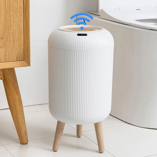 Upgrade your space with this sleek smart trash can featuring a motion sensor lid and modern wooden legs. Perfect for bathrooms, bedrooms, or dorms, it opens automatically for hands-free use—keeping your environment clean and hygienic. Stylish, functional, and easy to use!
