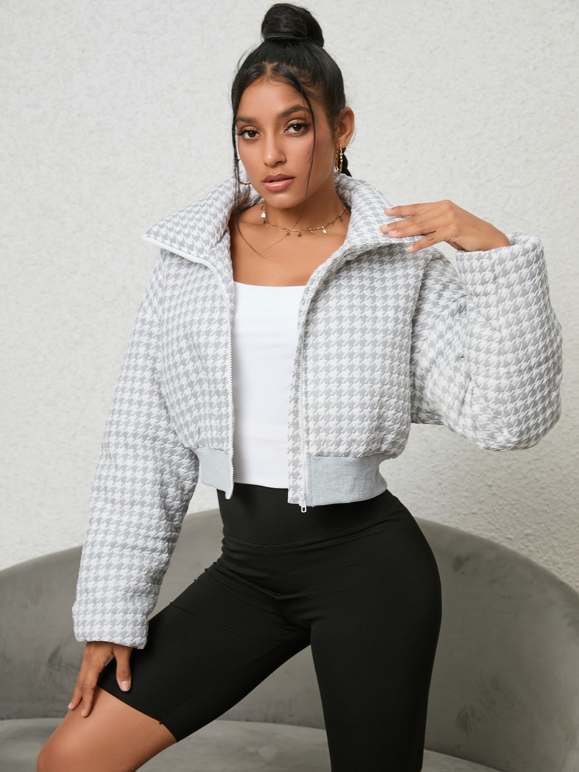Model wearing UniVibeShop Houndstooth Zip-Up Jacket in white – trendy cropped outerwear for women, perfect for layering in fall and winter.