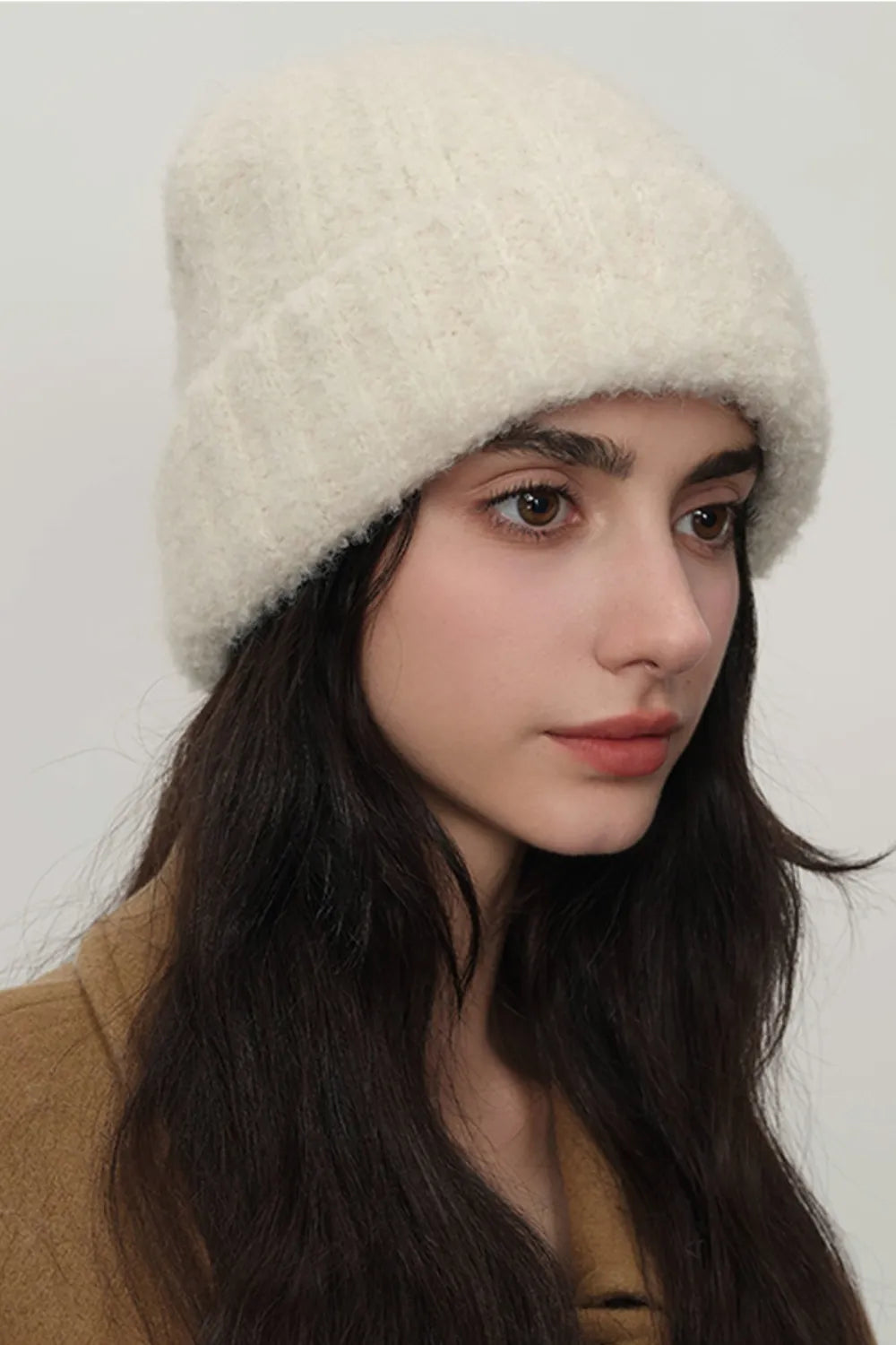 Model wearing UniVibeShop Solid Color Thermal Knit Hat – cozy, fluffy winter beanie available in cream, hot pink, chocolate, mauve, and more.