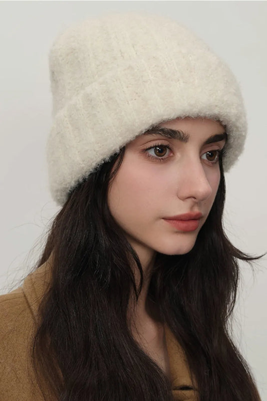 Model wearing UniVibeShop Solid Color Thermal Knit Hat – cozy, fluffy winter beanie available in cream, hot pink, chocolate, mauve, and more.