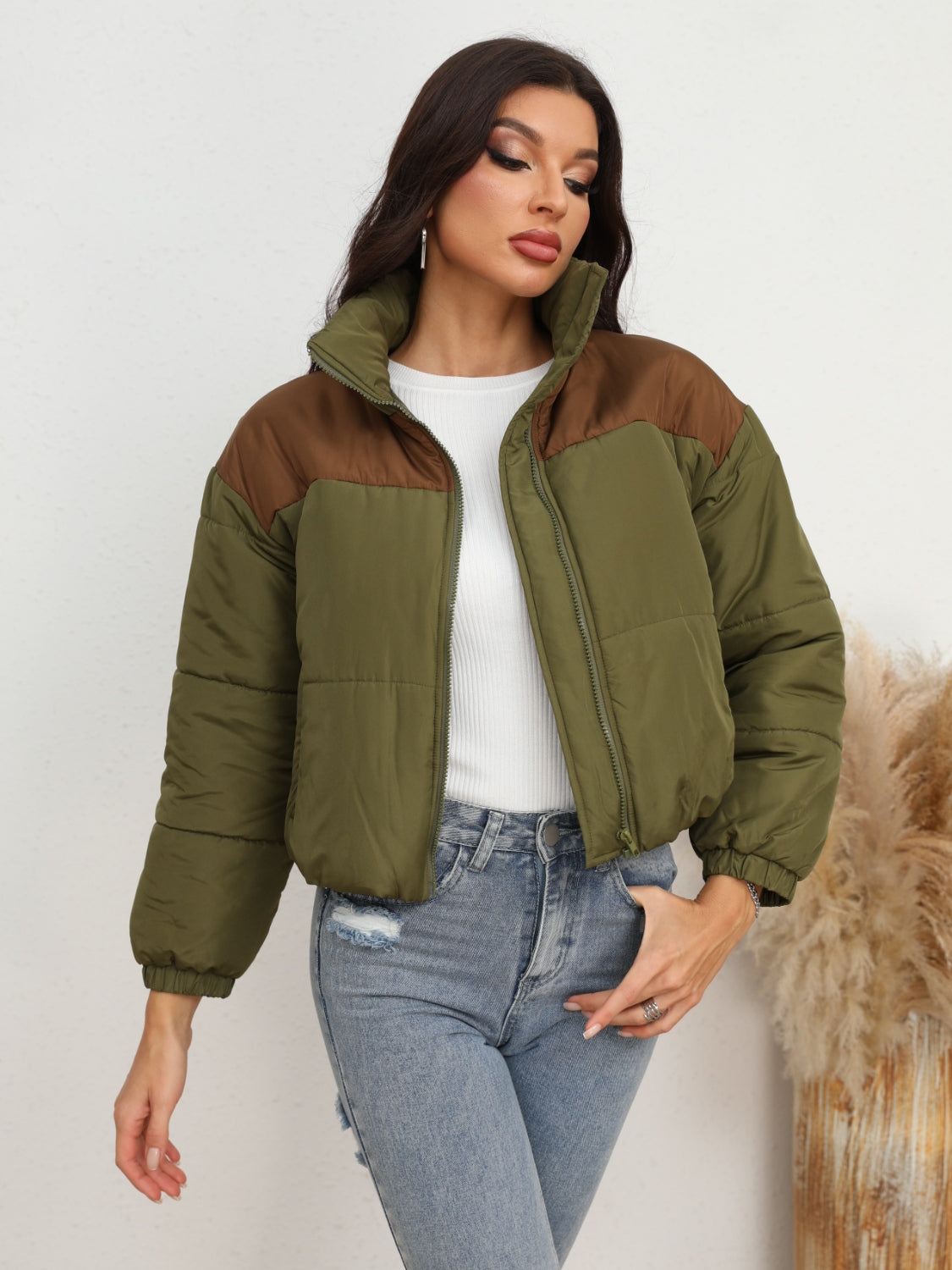 Model wearing UniVibeShop Two-Tone Zip-Up Puffer Jacket in Army Green – stylish and warm outerwear for men and women, perfect for fall and winter.